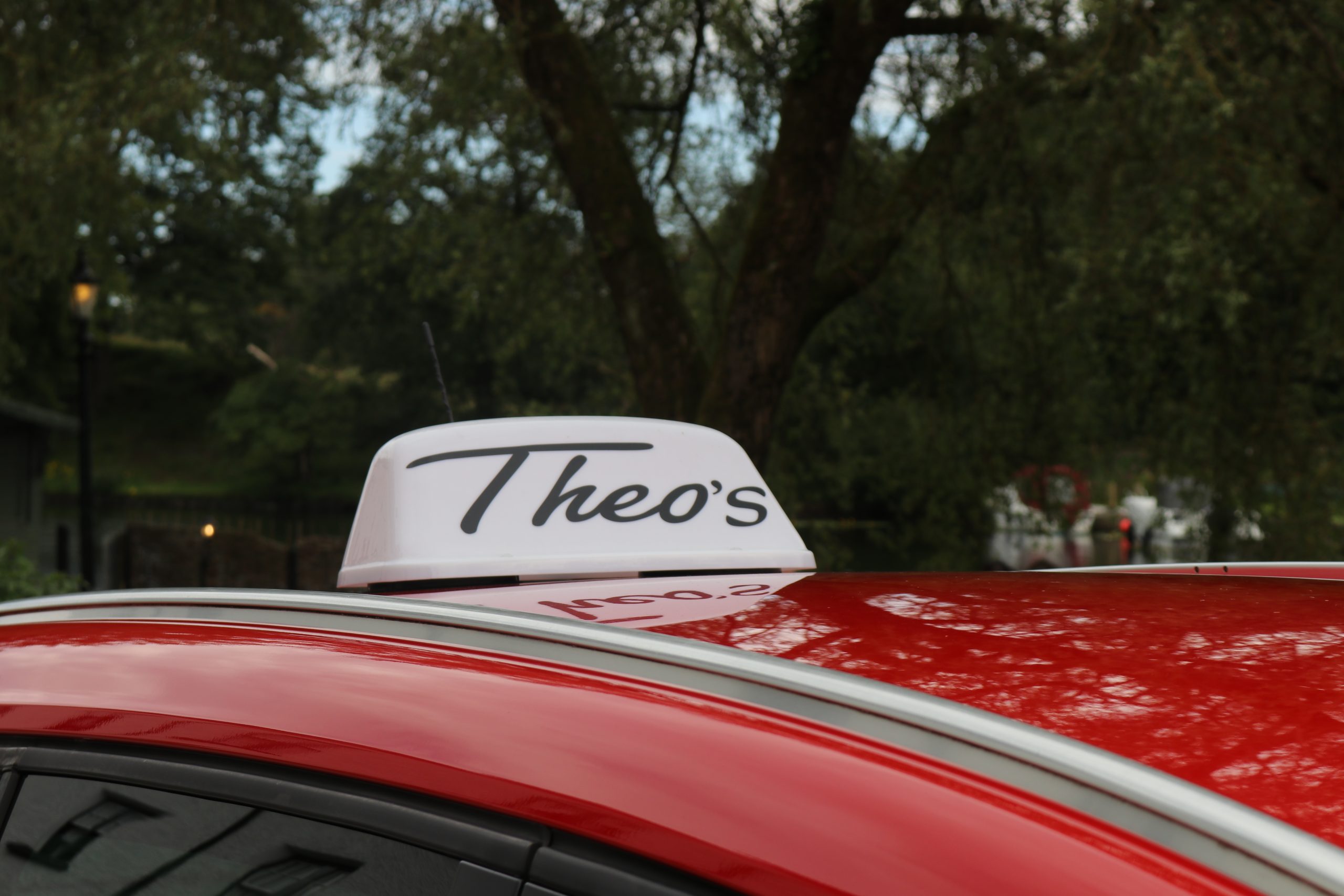 theos taxis roof sign on 6 seat taxi vehicle